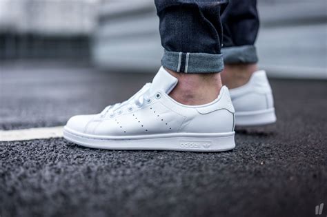 all white stan smith sneakers.